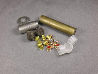 percussion caps and felt wad and brass shell for reloading