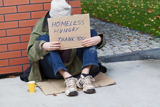Young homeless male begging for help