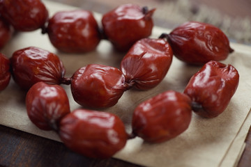 Close-up of smoked berry like sausages, horizontal shot