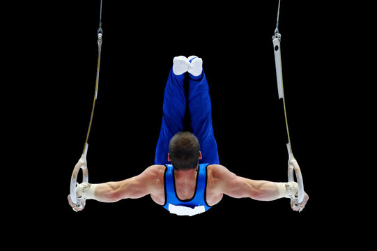 Gymnast Performing On The Rings