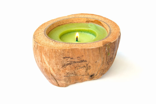 green Candle in a coconut shell