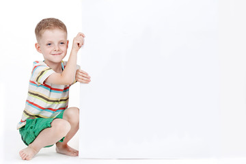 Smart boy with sheet of paper isolated on white