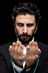 Western Muslim Praying with Tasbih