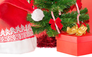 Open Gift and Santa Claus hat under Christmas tree