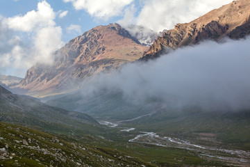 Mountain valley covered by clouds. Kyrgyzstan