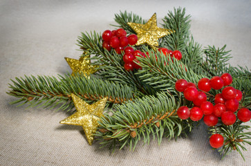 Fototapeta na wymiar gold star, viburnum berries and spruce branches