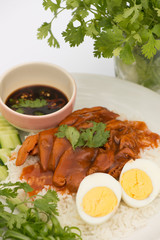 Thai cuisine red pork over rice with boiled egg