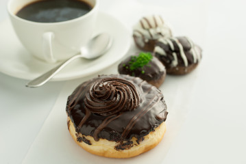 Chocolate donuts with coffee