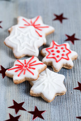 Gingerbread cookies over wooden background