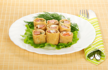 Pancakes with salmon and salad