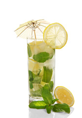 lass of cold mojito is decorated with umbrella
