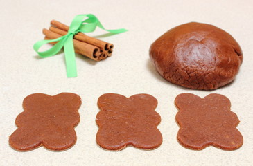 Gingerbread dough for Christmas cookies and cinnamon sticks