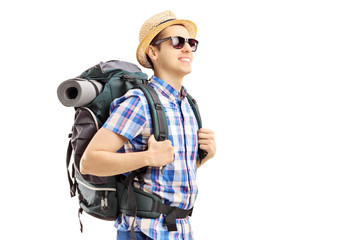 Fototapeta na wymiar Male tourist with backpack walking