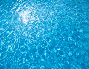 Flecks of sunlight in the water.