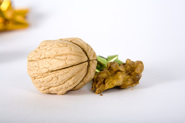 walnut and a cracked walnut on the white background