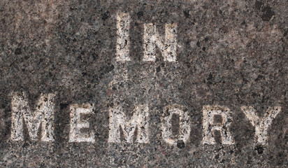 "In memory" words inscribed on a gravestone