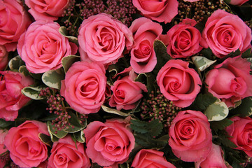 Skimmia and pink roses bridal arrangement