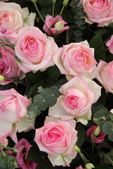 Pink wedding centerpiece: roses and eustoma