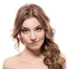 Lovely confused woman against white background