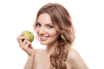 Smiling beauty holding green apple while isolated on white