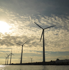 Obraz premium wind turbines power generator farm in sea