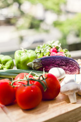 Fresh vegetables on wooden chopping board