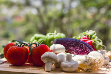 Fresh vegetables on wooden chopping board