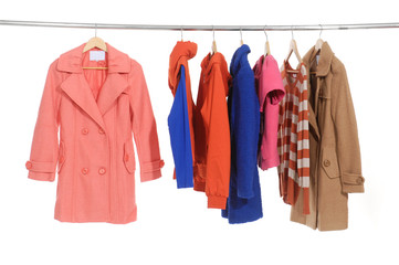 female coat clothing on hangers at the show