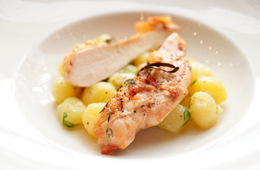 Chicken breast with potatoes on plate