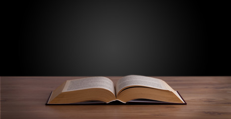 Open book on wooden deck