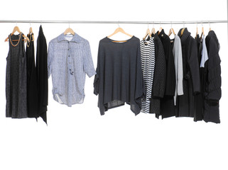 Set of female clothes hanging on clothes rack