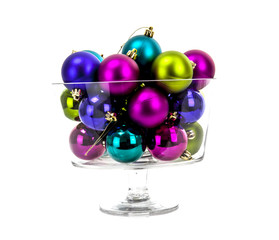 Multi-colored Christmas balls in a glass isolated on white