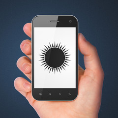 Travel concept: Sun on smartphone