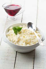 Cottage cheese and cherry jam.