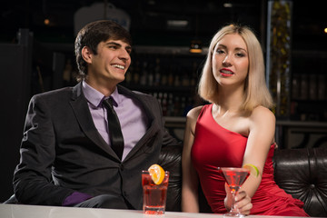 Young couple talking in a nightclub