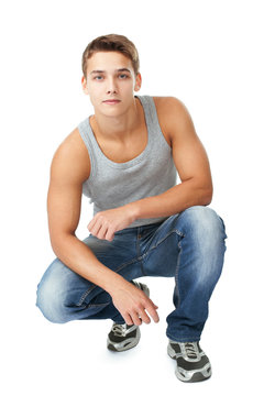 Portrait of young man squatting