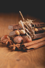 Cubes of chocolate lying on the boards. The composition decorate