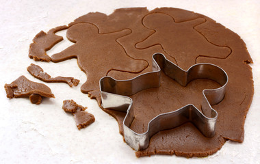 Gingerbread man shapes in cookie dough