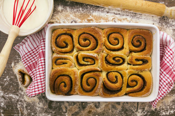 Baked and unglazed cinnamon rolls. above