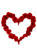 Red rose petals in a heart shape