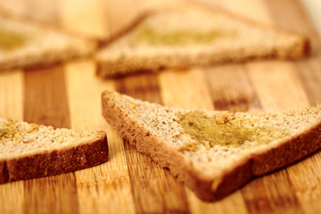 Fine sliced bread poured with olive oil.