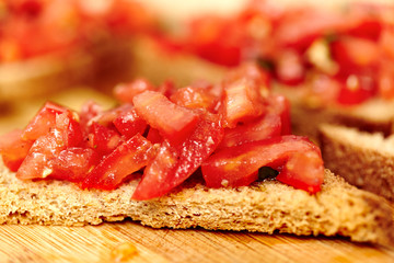 Tomato bruschetta on a wooden board