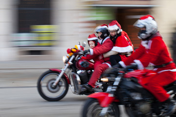 Fototapeta premium the parade of Santa Clauses on motorcycles in Cracow