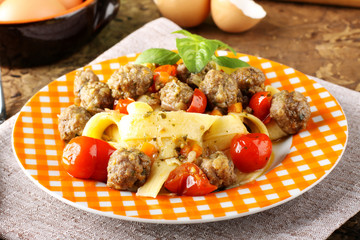 Fresh egg pasta with cherry tomatoes and meatballs