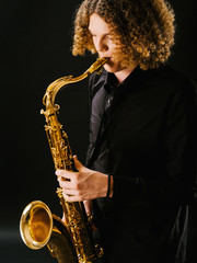 Fototapeta na wymiar Playing the saxophone