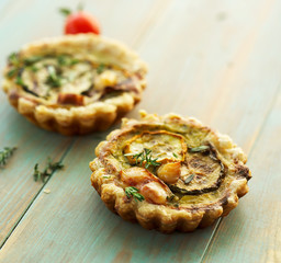 Quiche with grilled zucchini smoked cheese and herbs