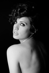 Woman with intense look on black background