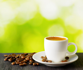 Cup of coffee on nature background