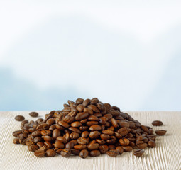 Coffee beans on highlands background