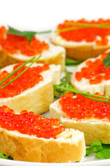 Snacks with Red Caviar, Butter, Parsley and Baguette